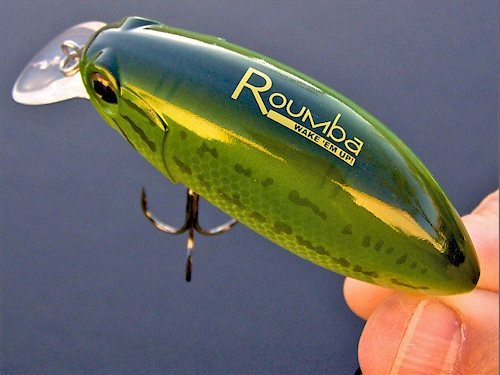 Premium Photo  Fishing tackle. float, wobbler, bait hooks, on a wooden  background. selective focus